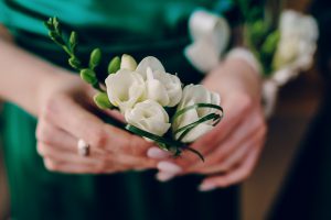 bridesmaids and groom prepare for the wedding in the color green